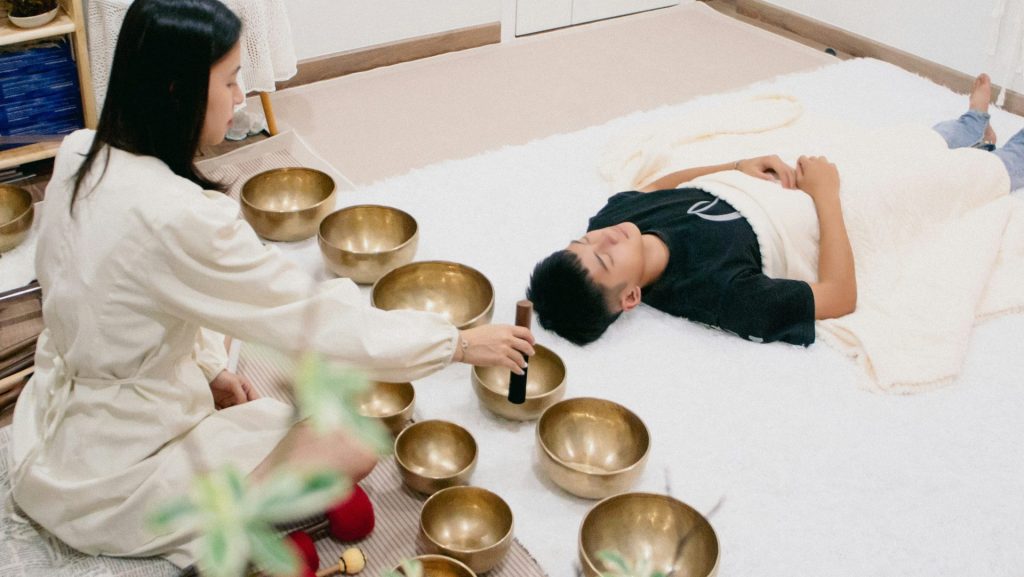 A couple of people that are laying on a bed