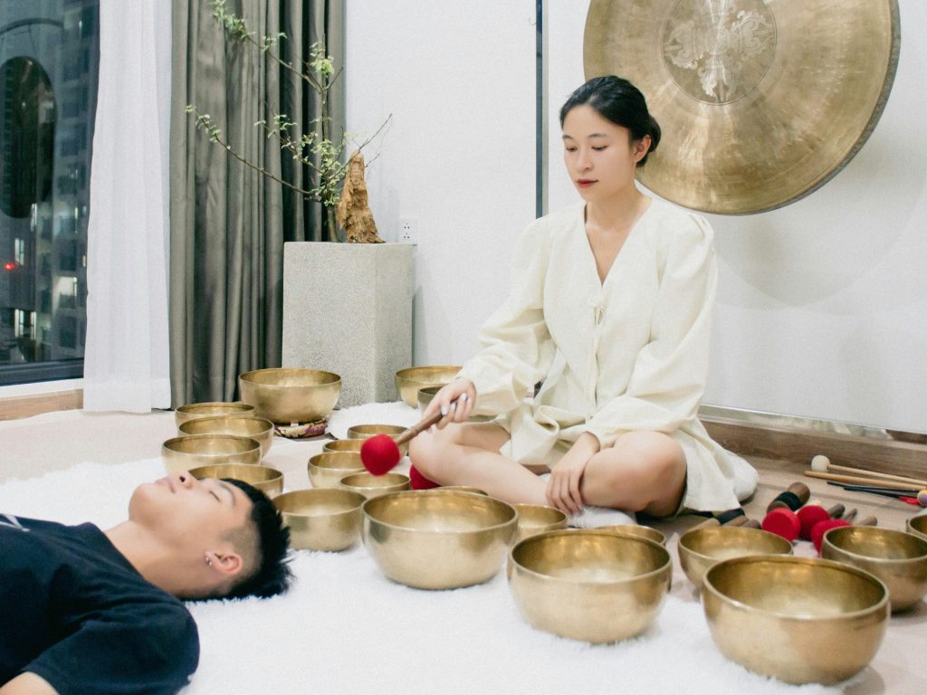 A couple of people that are sitting on a floor